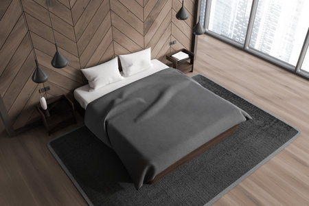 Top view of home bedroom interior with bed, nightstand with lamps and accent wall on hardwood floor. Relax room corner with panoramic window on skyscrapers. 3D renderingの写真素材