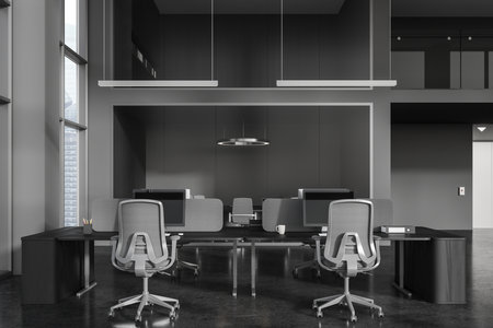 Interior of stylish two storey open space office with gray and glass walls, concrete floor and row of computer desks with gray chairs. 3d renderingの写真素材