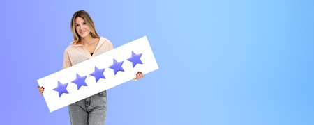 Portrait of cheerful young European businesswoman in casual clothes holding five star sign standing...