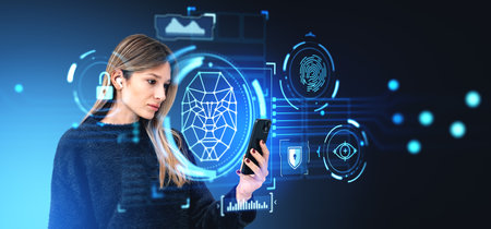Woman looking at smartphone in hand, wearing earbuds. Digital biometric scanning hud hologram, face...