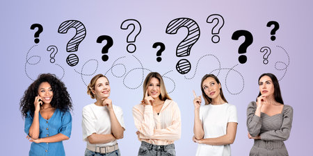 Smiling and positive young women students with hand to chin, finger point up at doodle question marks. Concept of idea, problem, thoughts and developmentの写真素材