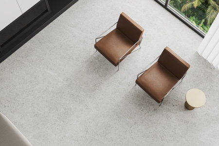 Top view of stylish home relax place interior with two brown leather armchairs, fireplace and light...