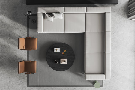 Top view of stylish lounge zone interior with L shaped sofa and two armchairs, coffee table with...