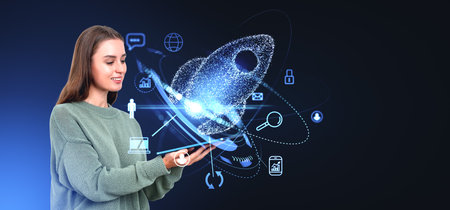 Smiling woman holding tablet, glowing rocket with diverse business and marketing icons. Concept of project, social media, connection, technology and innovationの写真素材
