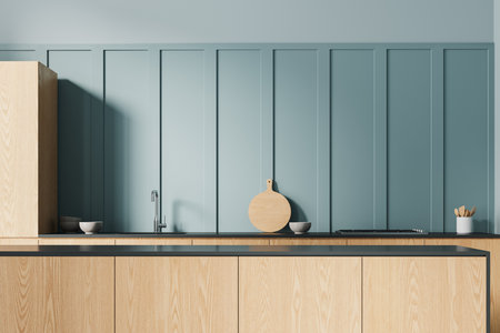 Blue home kitchen interior with bar island, wooden cabinet with sink and gas stove, counter with kitchenware. Cooking space in modern minimalist apartment. 3D renderingの写真素材