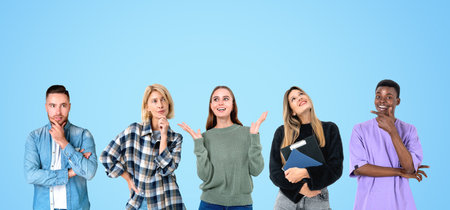 Group of Five diverse college students planning their future, teamwork concept. Copy space blue...