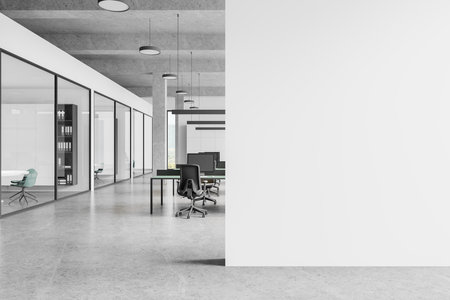 Industrial office interior with coworking space, pc computers on desks in row. Glass conference room with board. Panoramic window on Bangkok skyscrapers. Mock up empty wall partition. 3D renderingの写真素材