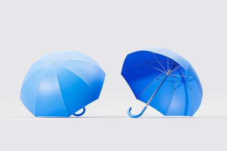Blue open umbrella from different angles, light copy space empty background. Concept of insurance, health care and protection. 3D rendering illustrationの写真素材