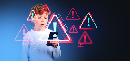 Surprised boy looking at the phone, glowing red warning signs hologram in row. Parental control and...