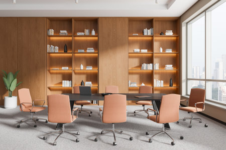 A modern conference room with a table, chairs, and wooden shelves filled with books and decor. Large...