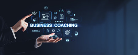 Hands interacting with various business coaching icons displayed in a futuristic digital interface on a dark background. Concept of coaching, training, education, and business successの写真素材