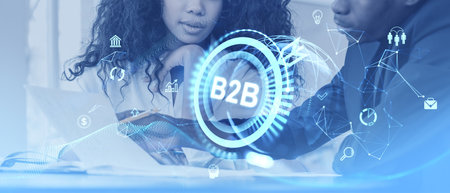 Business professionals discussing documents, surrounded by holographic icons and digital interface elements. Concept of technology and networkの写真素材