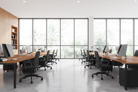 Spacious modern open-plan office with wooden desks and ergonomic chairs, featuring large windows with a scenic outdoor view, concept of productivity. 3D Renderingの写真素材