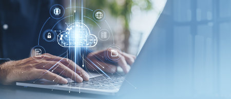 Closeup of man typing on laptop, binary cloud with digital symbol. Data storage, files transfer and...