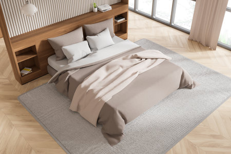 Top view of hotel bedroom interior with bed, nightstand with decoration on hardwood floor. Sleeping corner with panoramic window on tropics. 3D renderingの写真素材