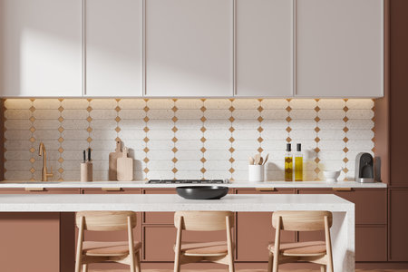 Luxury brown and white home kitchen interior with bar chairs and island, closeup. Kitchenware on counter with golden tap, sink and gas stove. Cooking area with minimalist cabinet. 3D renderingの写真素材