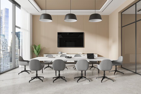 A modern conference room with gray chairs, large windows, beige walls, and a wall-mounted TV. Minimalist design. Cityscape background. 3D Renderingの写真素材