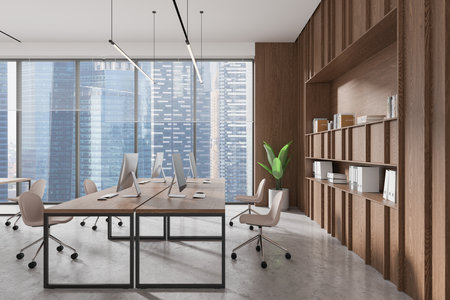 Modern open space office with wood accents, large windows, and sleek furniture. City skyline visible in background. 3D Renderingの写真素材