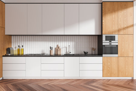 White and wooden home kitchen interior cabinet and kitchenware, hardwood floor. Cooking space design with sink, gas stove and oven in modern apartment. 3D renderingの写真素材