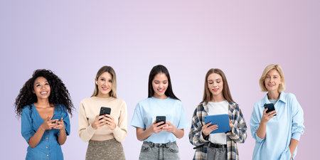Multinational happy women using devices in hands, empty copy space colored background. Smiling portraits with devices in row. Concept of network, messenger and online conferenceの写真素材