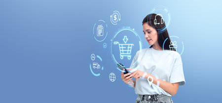 Young Asian woman portrait using smartphone. Glowing online shopping icons, shipping and delivery. Concept of manager in virtual supermarket, online services and e-commerceの写真素材
