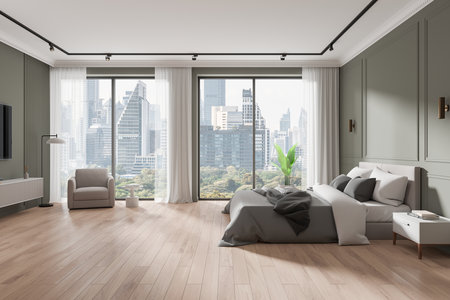 Elegant bedroom interior with large windows, wooden flooring, and a view of the city skyline. Contemporary design. 3D Renderingの写真素材