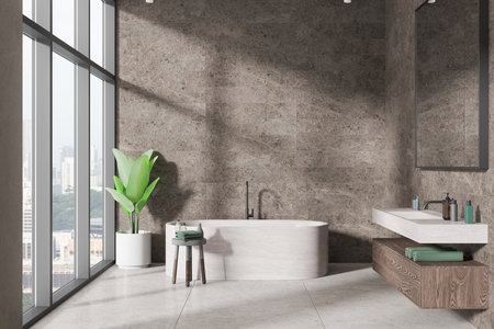 Stone home bathroom interior with bathtub, sink and dresser with mirror and accessories. Panoramic window on Singapore skyscrapers. Copy space empty wall. 3D renderingの写真素材