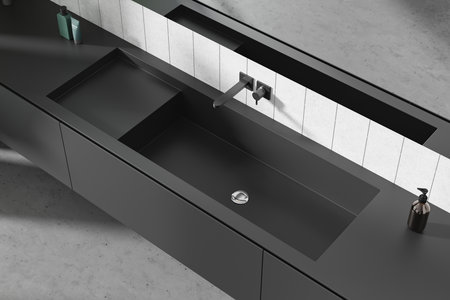 Top view of stylish hotel bathroom interior sink, closeup of black washbasin with soap bottle. Minimalist bathing space in elegant modern apartment. 3D renderingの写真素材