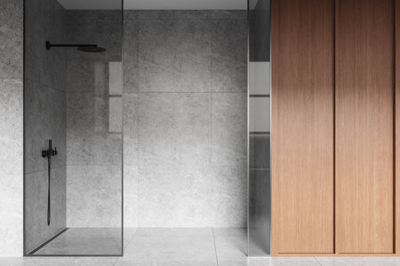 Gray stone hotel bathroom interior glass shower, wooden wardrobe. Bathing space with modern furniture in contemporary apartment, tile floor. 3D renderingの写真素材