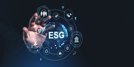 Hand reaching towards digital ESG icons on a dark background, representing environment, social, governance principlesの写真素材