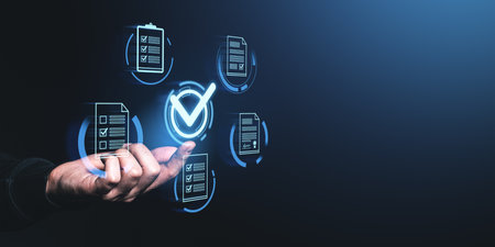 Hand interacting with digital checklist icons, glowing on a dark background. Concept of project approval and quality assuranceの写真素材