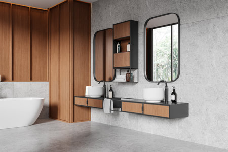 Corner view of hotel bathroom interior with bathtub, double sink and vanity with bathing accessories, wooden and tile design. Panoramic window on tropics. 3D renderingの写真素材