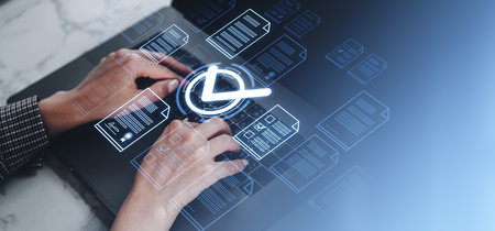 Hands typing on a laptop with digital document icons and a check mark overlay. Futuristic blue...