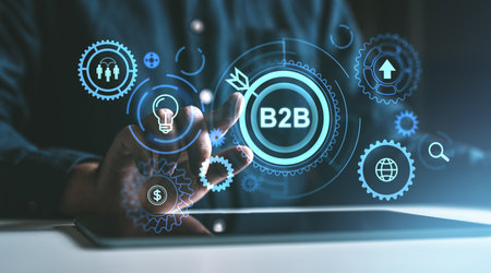 Hand interacting with B2B digital interface, icons, glowing blue background. Concept of business networking and online technology growthの写真素材