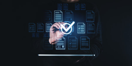 Man pen touch glowing check mark using tablet, document management system hologram files or certifications. Concept of online evaluation and digital analysisの写真素材