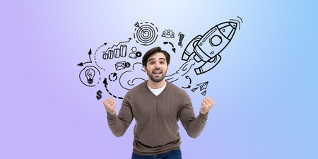 Happy young man with raised fists. Doodle sketch with start up plan and strategy on gradient background, graphs and rocket launch. Concept of success, profit and winの写真素材