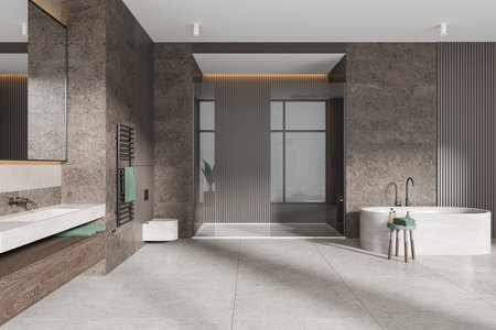 Stylish stone home bathroom interior with glass shower, sink and wall hung toilet, side table with accessories. Beige bathing space design in stylish apartment. 3D renderingの写真素材