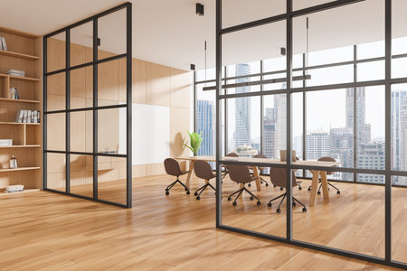 Spacious, modern office interior with large windows showcasing a cityscape. Features wooden floors and glass partitions. Business concept. 3D Renderingの写真素材