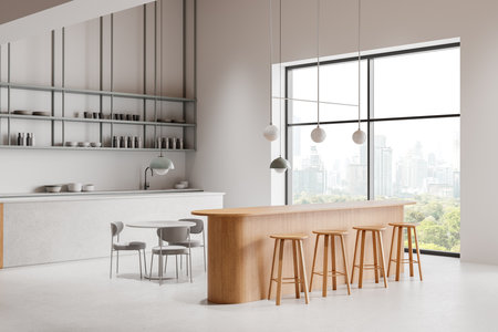 Minimalist kitchen with wooden bar, stools, round table, and city view through large windows. Neutral tones. Contemporary design. 3D Renderingの写真素材