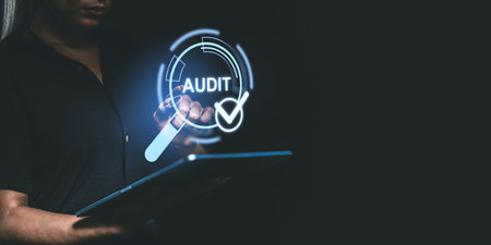 Person interacting with digital audit hologram on dark background, highlighting approval and quality check concepts in tech styleの写真素材