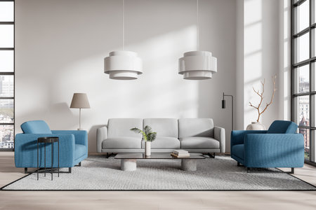 A modern living room featuring a gray sofa, blue armchairs, and minimalist decor in a bright, spacious interior. Design concept of modern home. 3D Renderingの写真素材