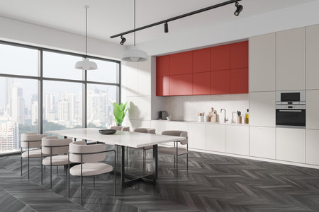 Stylish kitchen with red cabinets, modern design, city view through large windows, sleek interior, home concept. 3D Renderingの写真素材