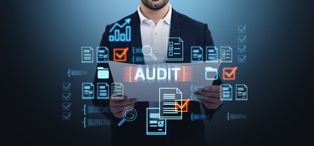 Businessman holding audit documents with digital overlays, showing a futuristic business concept on a dark gradient backgroundの写真素材