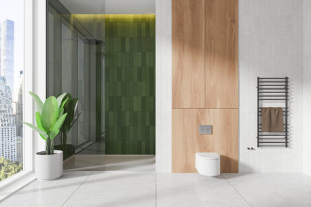Modern bathroom with green shower tiles, wood paneling, and a towel rack. Minimalist style, bright windows. Interior design concept. 3D Rendering.の写真素材