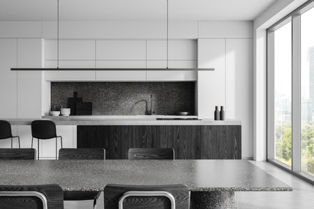 Modern kitchen interior featuring sleek black and white cabinets, large windows, and minimalist design. Background concept of luxury home. 3D Rendering.の写真素材