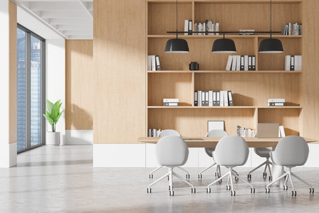 A modern office interior featuring a meeting table, chairs, bookshelves, large windows, and a plant. open space concept emphasized by natural light and simplicity. 3D Renderingの写真素材