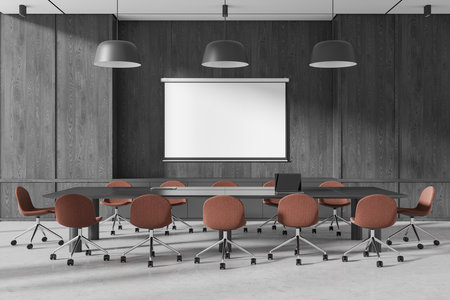 A modern conference room with a long board table and brown chairs on a concrete floor. Dark wood paneled walls, large ceiling lights, minimalist concept. 3D Renderingの写真素材