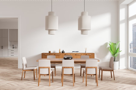 Minimalist dining room features wooden furniture and modern lighting fixtures. Neutral tones and potted plant add elegance to the bright interior space. 3D Renderingの写真素材
