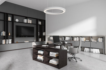 Modern office interior with a large desk, chairs, and a computer. Bookshelves line the walls. Minimalistic design with neutral tones. Workplace concept. 3D Rendering.の写真素材
