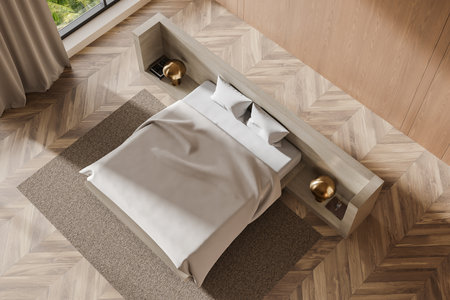 Top view of a cozy modern bedroom with a wooden floor, beige bedding, and bedside lamps. Neutral tones dominate the minimalist interior design concept. 3D Rendering.の写真素材